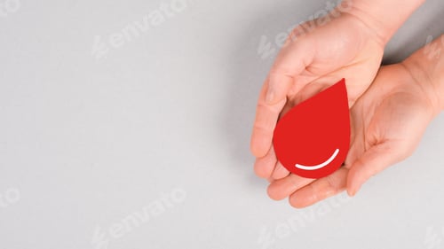 Preview: Holding a red drop in the hands, donate blood, world blood donor day, health care