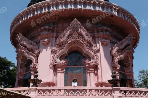 Preview: Erawan Museum In Bangkok City, Thailand, And Tourist Girl In Asian Hat. Pink Windows Of Erawan