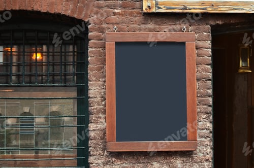 Preview: Facade of building with blank advertising board on city street. Space for design