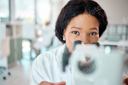 Preview: Nothing will remain hidden. Shot of a young scientist using a microscope in a lab.