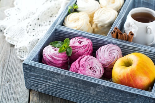Preview: Homemade marshmallows on a light background. Russian currant and mango zephyr. Selective focus