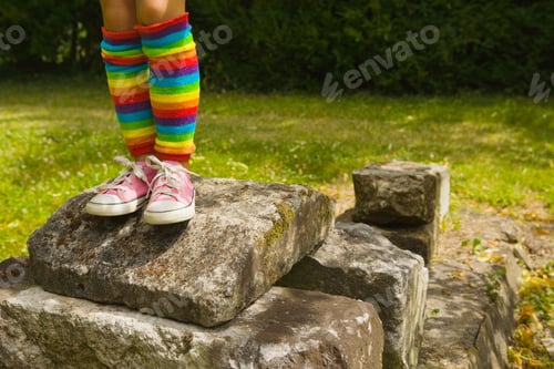 Preview: A girl standing on rocks