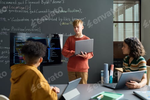 Preview: Teenage Caucasian Boy Presenting Programming Project to Diverse Classmates
