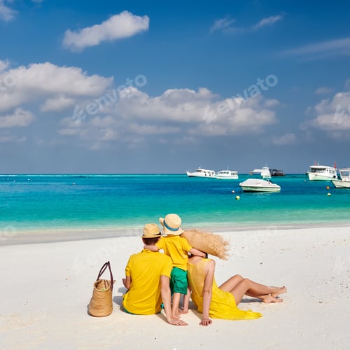 Preview: Family On Beach, Young Couple In Yellow With Three Year Old Boy. Summer Vacation At Maldives.