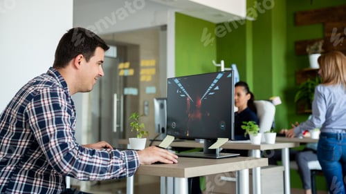Preview: Man playing video games during working hours
