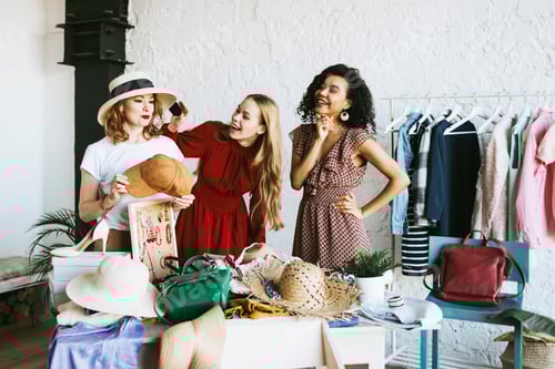 Preview: Stylish Young Women Enjoying a Clothing Exchange Event
