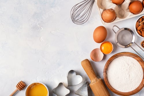 Preview: Ingredients for baking - flour, wooden spoon, eggs.