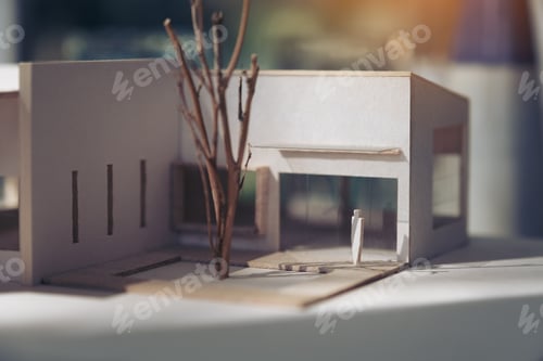 Preview: An architecture model with shop drawing paper and laptop on table