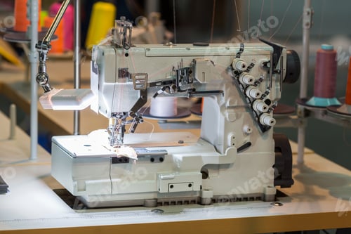 Preview: Sewing machine and cloth in cutting shop, nobody