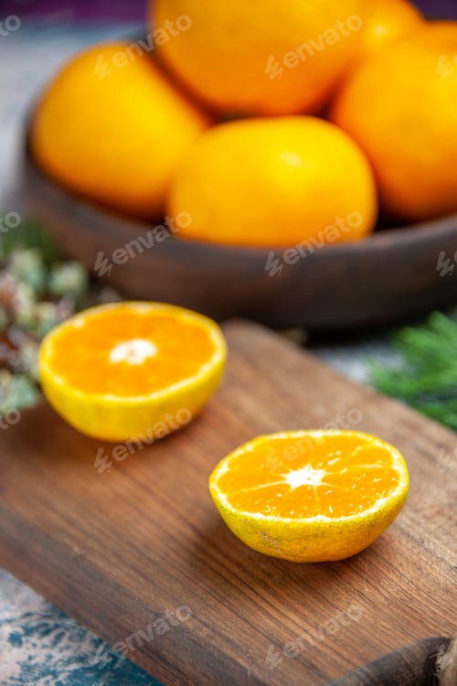 Preview: front view fresh tangerines on light-blue background citrus juice tree color photo fruit
