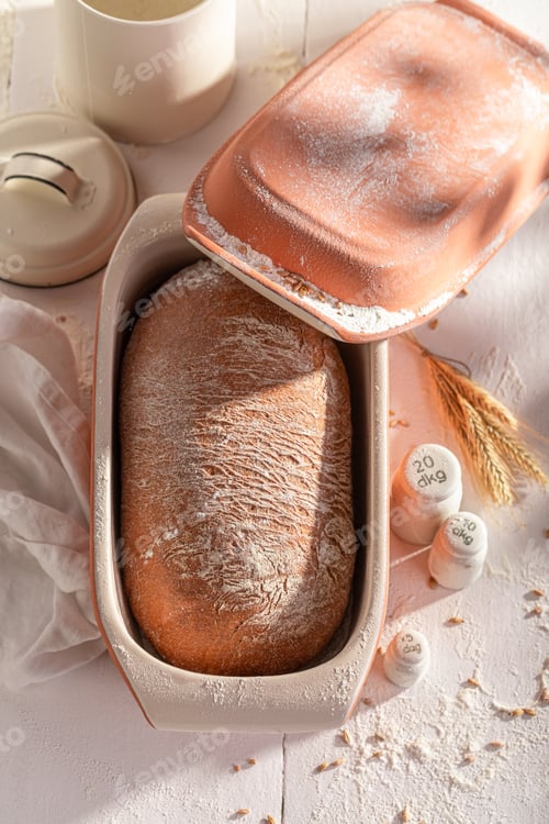 Preview: Hot loaf of bread baked in a baking mold.