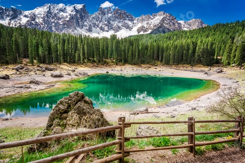 Preview: Sunny day in mountain Carezza lake in Dolomites, Italy