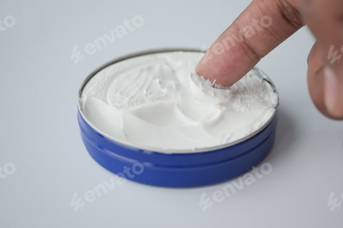 Preview: man applying beauty cream onto skin