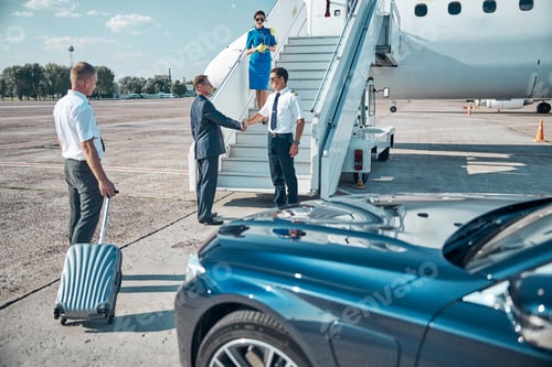Preview: Jet staff meeting vip passenger on stairway