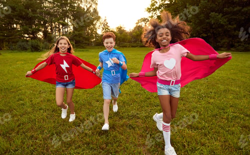 Preview: Cheerful little superheros running in park