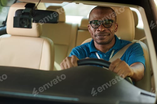 Preview: Man in Glasses Driving Car to Work