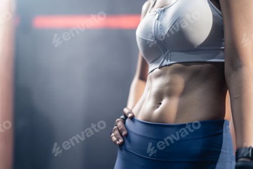 Preview: Close up of Athlete woman stand with confidence after abdomen cardio workout exercise in stadium.