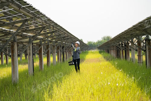 Preview: Engineer electric man checking and maintenance of solar cells.