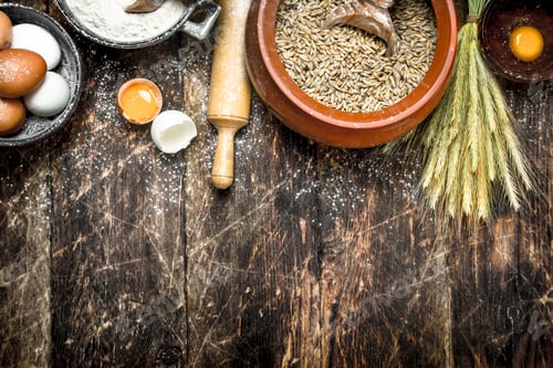 Preview: Dough background. Flour with wheat grains and fresh eggs.