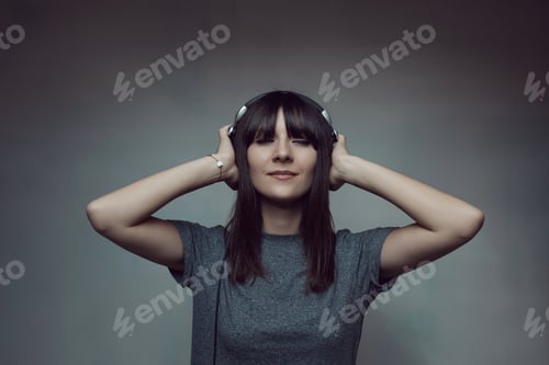 Preview: Pretty brunette woman posing in light room