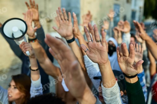 Preview: Close-up of group of activists with raised arms on public demonstrations.