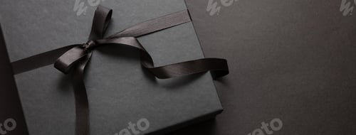 Preview: Black Friday sale concept, Gift box with ribbon bow on black background