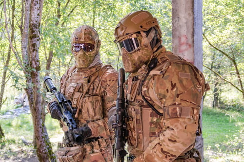 Preview: People in military uniforms with firearms are practicing combat techniques at military exercises