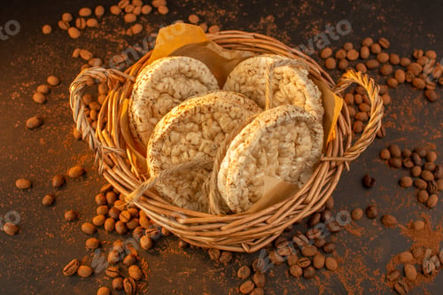Preview: a top view brown coffee seeds with basket of crackers all over the the brown background coffee seed