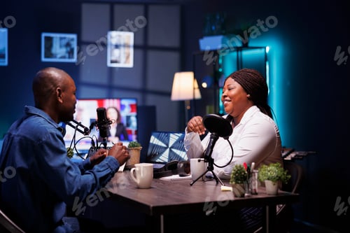 Preview: Couple happily recording podcast episode