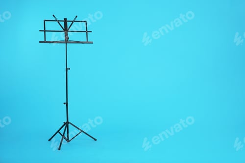 Preview: Empty music note stand on color background. Space for text