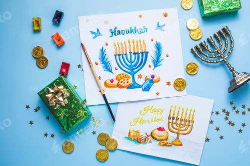 Preview: Hanukkah symbols flat lay. Traditional jewish holiday greeting card design with happy hanukkah