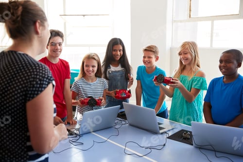 Preview: Group Of Students In After School Computer Coding Class Learning To Program Robot Vehicle
