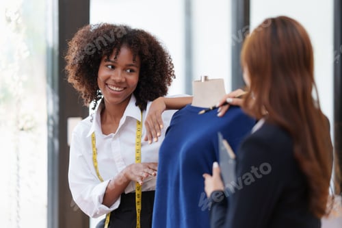 Preview: Fashion Designer Working With Client on New Design