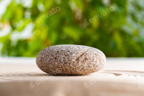 Preview: Japanese zen garden with stone in raked sand
