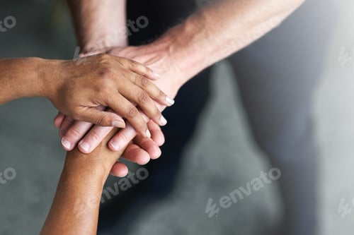 Preview: The birth of a team. Cropped shot of two peoples hands together in unity.