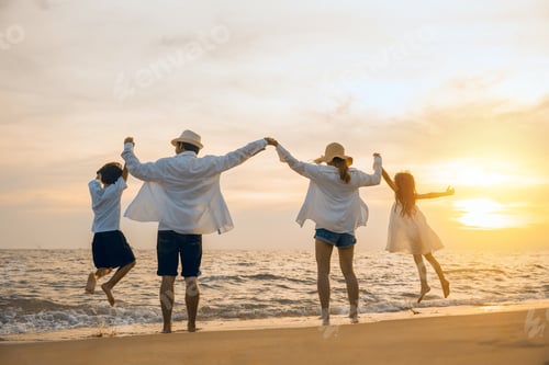 Preview: Silhouette of family holding hands live healthy lifestyle on beach