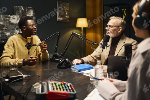 Preview: People Discussing Book During Podcast In Studio