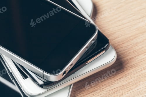 Preview: Digital tablet and mobile phone. Electronic devices on wooden table, close up