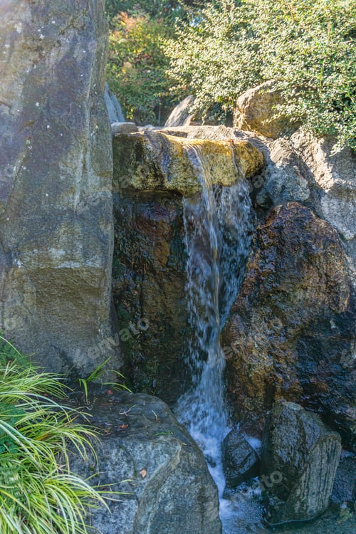 Preview: A Closup Shot Of A Small Waterfall In Seatac, Washington,