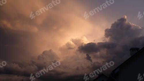 Preview: Dramatic sky. Fragment of a house against the backdrop of a sunset or sunrise, a purple sky