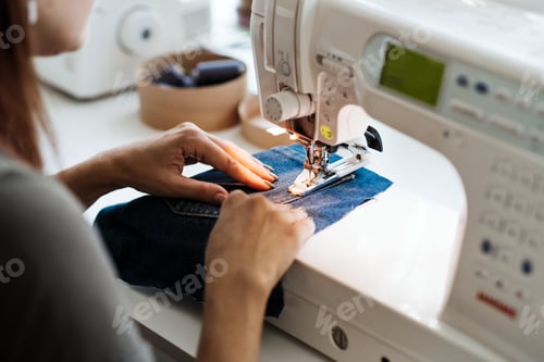 Preview: Reuse, repair, upcycle. Denim upcycling ideas, repair and using old jeans. Close-up of sewing