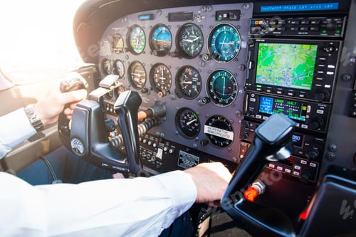 Preview: Hands on hand-wheel of Pilot in Airplane during fly