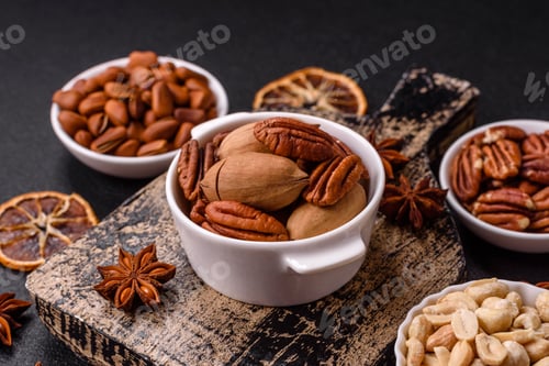 Preview: Delicious nutritious pecan nuts in ceramic bowl