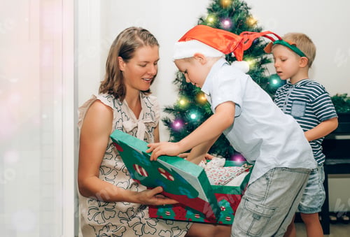 Preview: Festive Family Unveiling Christmas Presents at Home