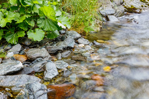 Preview: long exposure of a River stream on mountain valley.