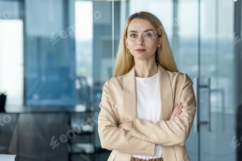 Preview: Confident businesswoman standing in modern office setting