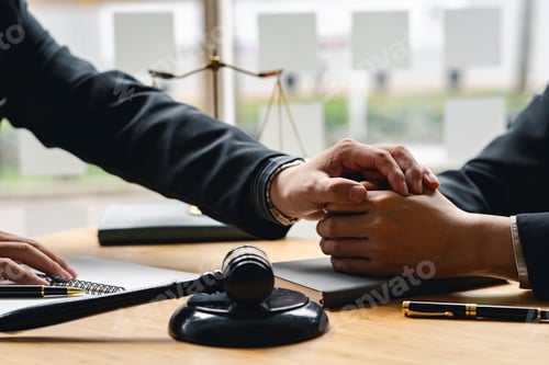 Preview: Male lawyer discussing cheer up negotiation legal case with client meeting with document contact in