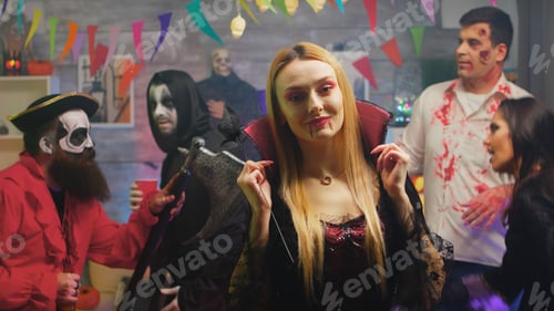 Preview: Sexy blonde in enchantress costume at halloween party