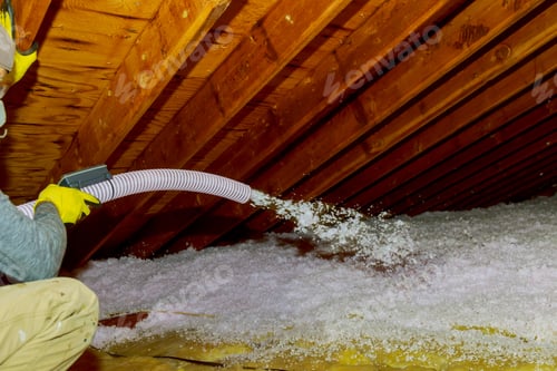 Preview: Technician spraying blown Fiberglass Insulation between Attic Trusses foam insulation repair tool in
