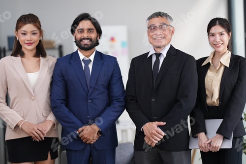 Preview: Group of executive staff standing diligently and politely